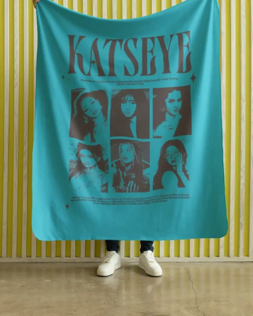 model holding green katseye flannel blanket with band members design